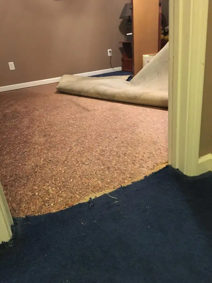 Carpet pad removal revealing water damage during Drying & Dehumidification in Sherman